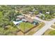 Aerial view of the property, showcasing the home's layout, backyard pool, and neighborhood at 808 Austin Cir, Bartow, FL 33830