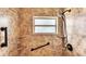Detailed view of the bathroom shower, highlighting the tile work, grab bars, and shower head at 808 Austin Cir, Bartow, FL 33830