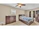 Comfortable bedroom with tile floors, ceiling fan, a window, and plenty of space at 808 Austin Cir, Bartow, FL 33830