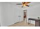 Spare bedroom features a ceiling fan, closet, and tile flooring at 808 Austin Cir, Bartow, FL 33830