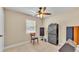 Bedroom with a ceiling fan, window, tile floor, and room for all of your music equipment at 808 Austin Cir, Bartow, FL 33830