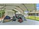 The outdoor carport offers shaded parking and storage space in the backyard of the property at 808 Austin Cir, Bartow, FL 33830