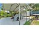View of the carport area with covered parking space and additional storage shed in the backyard at 808 Austin Cir, Bartow, FL 33830