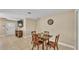 Open-concept dining area with tile flooring and a view of the living room and kitchen at 808 Austin Cir, Bartow, FL 33830