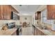 Bright kitchen with stainless steel appliances, granite countertops and an adjacent dining area at 808 Austin Cir, Bartow, FL 33830