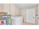 Practical laundry room with modern washer and dryer, and water heater at 808 Austin Cir, Bartow, FL 33830