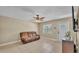 Comfortable living room with tile flooring, ceiling fan, and ample natural light at 808 Austin Cir, Bartow, FL 33830