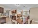 Open living space featuring a kitchen with granite countertops and stainless steel appliances at 808 Austin Cir, Bartow, FL 33830