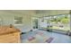 Covered patio with a wooden bar, sliding door, and view of the fenced in yard at 808 Austin Cir, Bartow, FL 33830