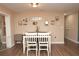 Inviting dining area with a table, seating for four, and charming decor, perfect for enjoying meals with Gathering and friends at 5732 Sawyer Rd, Lakeland, FL 33810
