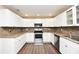 Well-lit kitchen featuring stainless steel appliances, and ample counter space, ideal for cooking and entertaining at 5732 Sawyer Rd, Lakeland, FL 33810