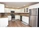Modern kitchen featuring stainless steel appliances, granite countertops, and ample cabinet space, perfect for culinary enthusiasts at 5732 Sawyer Rd, Lakeland, FL 33810