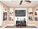 Living room featuring built-in shelving and a modern TV setup at 5732 Sawyer Rd, Lakeland, FL 33810