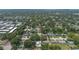 Aerial view of a lush, green suburban neighborhood with mature trees at 3813 Surrey Dr, Orlando, FL 32812