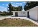 The backyard features a pool and modern building with new landscaping at 3813 Surrey Dr, Orlando, FL 32812