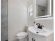 Bathroom features modern vanity, lighted mirror, and marble-look shower at 3813 Surrey Dr, Orlando, FL 32812