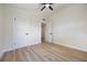 Neutral bedroom featuring light wood floors and white doors and trim at 3813 Surrey Dr, Orlando, FL 32812