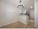 Open-concept dining room showcasing wood floors, bright lighting, and modern finishes at 3813 Surrey Dr, Orlando, FL 32812
