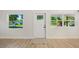 Entryway with a decorative front door, wood flooring, and natural light at 3813 Surrey Dr, Orlando, FL 32812