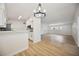 Open-concept living room showcasing wood floors, bright lighting, and modern finishes at 3813 Surrey Dr, Orlando, FL 32812