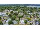 A charming neighborhood is showcased from above, featuring lush greenery and diverse architectural styles at 1013 Pennsylvania Ave, Lakeland, FL 33803