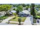 An elevated view displaying the home's inviting front porch and well-kept landscaping at 1013 Pennsylvania Ave, Lakeland, FL 33803