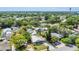 A high-angle shot showcases the home among the trees and neighborhood at 1013 Pennsylvania Ave, Lakeland, FL 33803