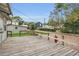 Exterior backyard view with a wooden deck, and manicured lawn at 1013 Pennsylvania Ave, Lakeland, FL 33803