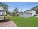 Expansive backyard view featuring a storage shed and brick-paved patio area at 1013 Pennsylvania Ave, Lakeland, FL 33803