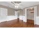 Bedroom with wood floors, closet, neutral paint and access to an ensuite bathroom at 1013 Pennsylvania Ave, Lakeland, FL 33803