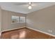 Bedroom featuring hardwood floors, natural light, and neutral paint at 1013 Pennsylvania Ave, Lakeland, FL 33803