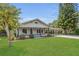 Charming home with a covered porch, large front yard, and covered parking at 1013 Pennsylvania Ave, Lakeland, FL 33803