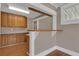 Eat-in kitchen with bar seating, wood cabinetry, and tile floors at 1013 Pennsylvania Ave, Lakeland, FL 33803