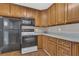 Kitchen with wood cabinets, and black appliances at 1013 Pennsylvania Ave, Lakeland, FL 33803