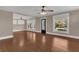 Living room featuring hardwood floors, natural light, and a ceiling fan at 1013 Pennsylvania Ave, Lakeland, FL 33803