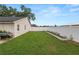 Spacious backyard featuring lush green grass, a privacy fence, and a well-maintained lawn at 1130 Ewell Rd, Lakeland, FL 33811