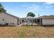 Screened pool area features a rectangular pool, a deck area, and the backyard at 1130 Ewell Rd, Lakeland, FL 33811