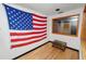 Features a view of another room and a large US flag on the wall at 1130 Ewell Rd, Lakeland, FL 33811