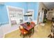 Dining area overlooking the pool with natural light at 1130 Ewell Rd, Lakeland, FL 33811