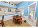 Dining Area with large windows overlooking the pool at 1130 Ewell Rd, Lakeland, FL 33811