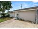 Charming home featuring a front entrance with a well-maintained lawn and beautiful landscaping at 1130 Ewell Rd, Lakeland, FL 33811