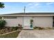Charming home featuring a front entrance with a well-maintained lawn and beautiful landscaping at 1130 Ewell Rd, Lakeland, FL 33811