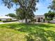 Charming home with a landscaped front yard, well-maintained lawn, and inviting curb appeal at 1130 Ewell Rd, Lakeland, FL 33811