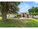 Charming home with a landscaped front yard, well-maintained lawn, and inviting curb appeal at 1130 Ewell Rd, Lakeland, FL 33811
