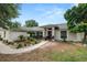 Beautiful home with a landscaped front yard, well-maintained lawn, and inviting curb appeal at 1130 Ewell Rd, Lakeland, FL 33811