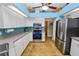 Kitchen with stainless steel appliances, white cabinets, and granite countertops at 1130 Ewell Rd, Lakeland, FL 33811