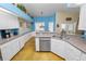 Bright kitchen with stainless steel appliances and granite countertops, lots of natural light at 1130 Ewell Rd, Lakeland, FL 33811