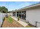 Back patio area with view to the pool area seen through sliding glass doors at 1130 Ewell Rd, Lakeland, FL 33811