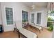 Relaxing screened patio with lounge chairs and ceiling fan, ideal for outdoor living at 1130 Ewell Rd, Lakeland, FL 33811