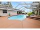 Beautiful pool area with screened enclosure, providing a private and enjoyable outdoor space at 1130 Ewell Rd, Lakeland, FL 33811